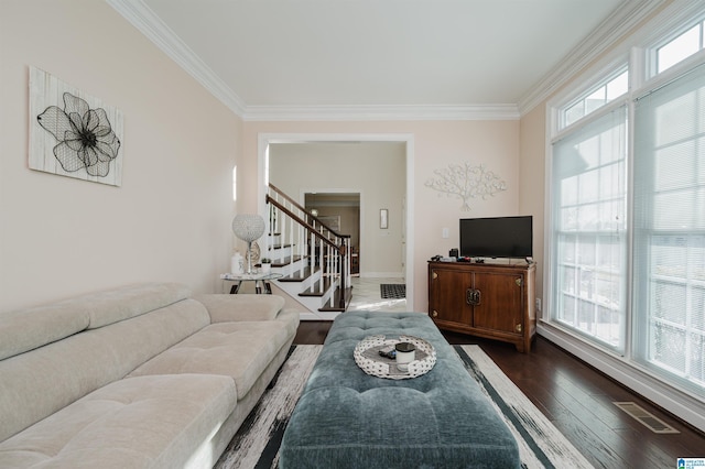 living room with dark hardwood / wood-style flooring and ornamental molding