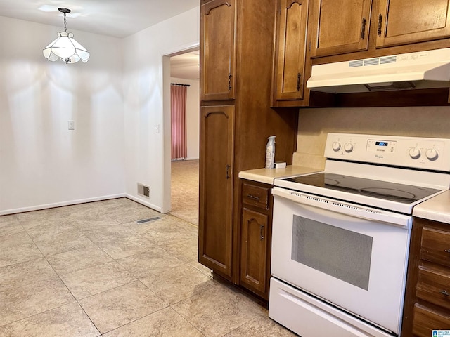 kitchen featuring hanging light fixtures and white electric stove