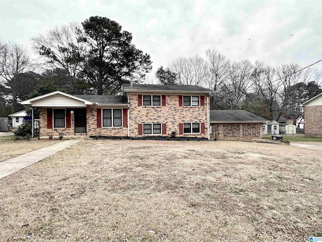 tri-level home featuring a front yard