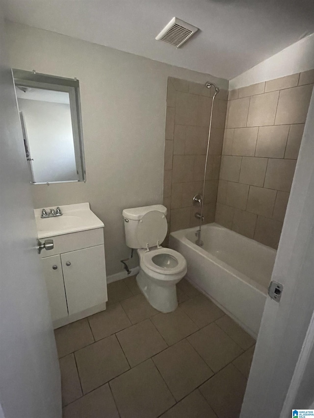 bathroom with tile patterned flooring, toilet, vanity, visible vents, and  shower combination