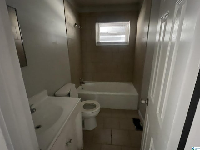 bathroom featuring shower / tub combination, vanity, toilet, and tile patterned floors