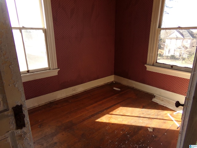 unfurnished room with dark hardwood / wood-style floors