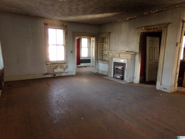 unfurnished living room featuring hardwood / wood-style flooring