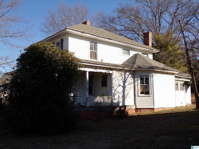 view of side of home featuring a porch