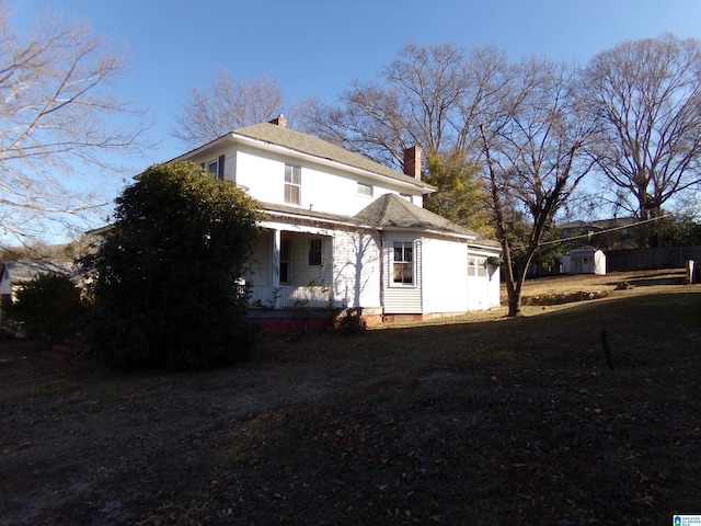 view of front of house featuring a shed