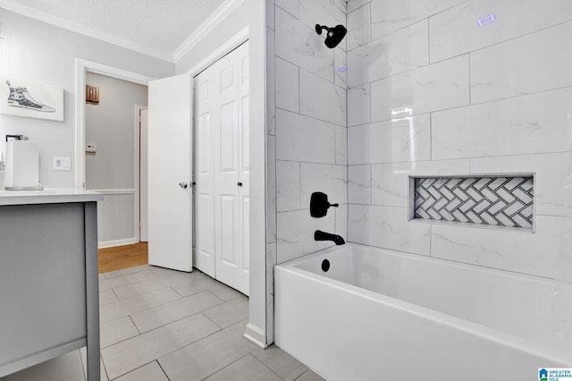 bathroom with tile patterned floors, tiled shower / bath, and ornamental molding