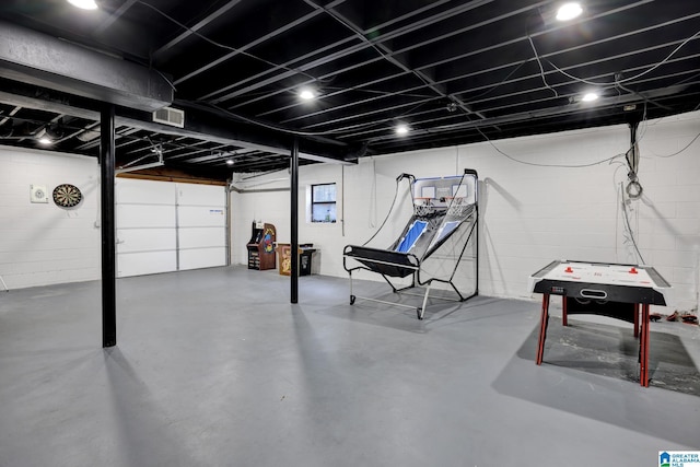 rec room featuring concrete floors