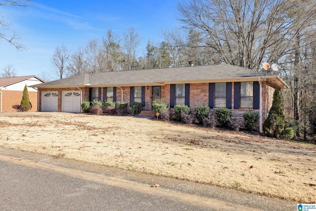 single story home featuring a garage