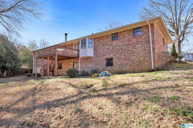 back of house featuring a deck