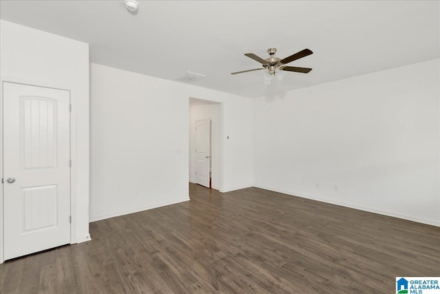 unfurnished room with dark hardwood / wood-style floors and ceiling fan