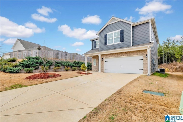 view of front facade featuring central AC, a garage, and a front lawn