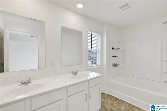 bathroom featuring shower / bathtub combination and vanity