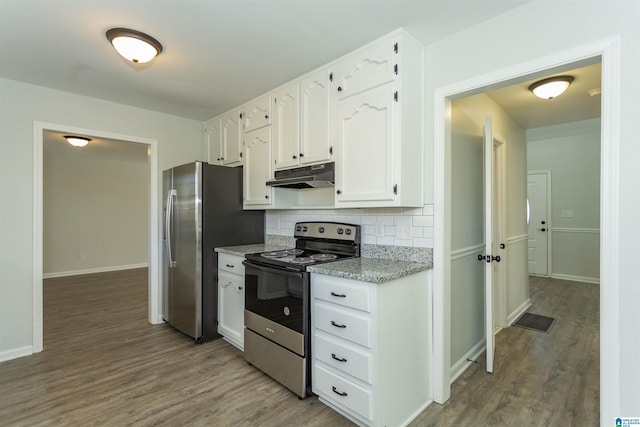 kitchen featuring hardwood / wood-style flooring, white cabinets, decorative backsplash, and stainless steel appliances