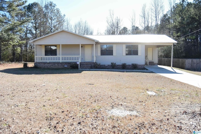 single story home with covered porch and a carport