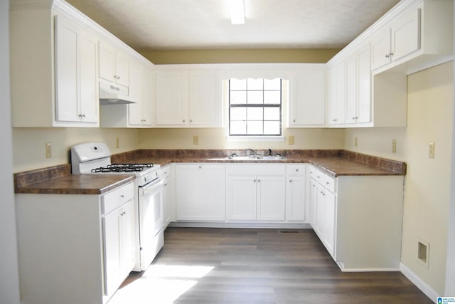 kitchen featuring sink, white cabinetry, white range with gas cooktop, and dark wood-type flooring