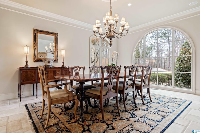 dining area featuring a notable chandelier and ornamental molding