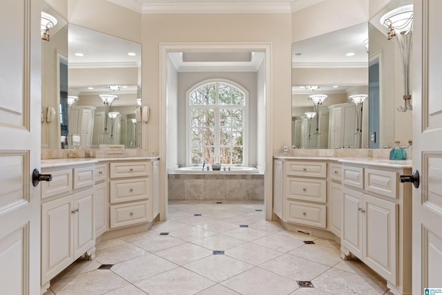 bathroom featuring vanity, ornamental molding, tiled bath, and tile patterned flooring