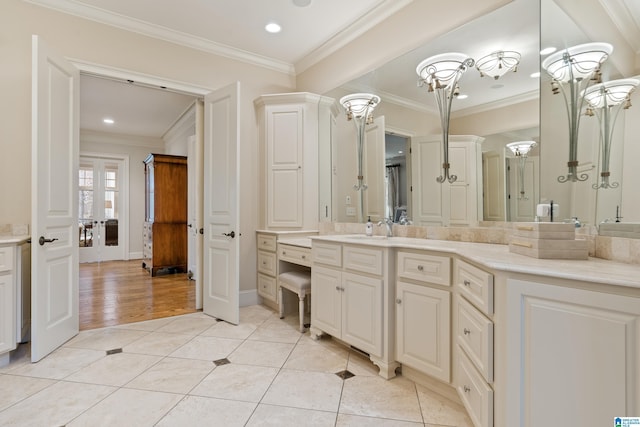 bathroom with tile patterned floors, vanity, and ornamental molding