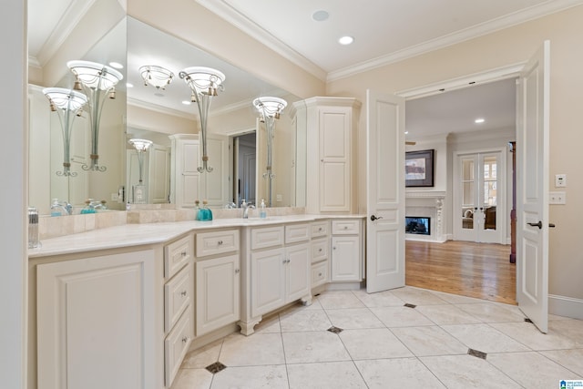 bathroom with vanity, crown molding, french doors, and tile patterned flooring