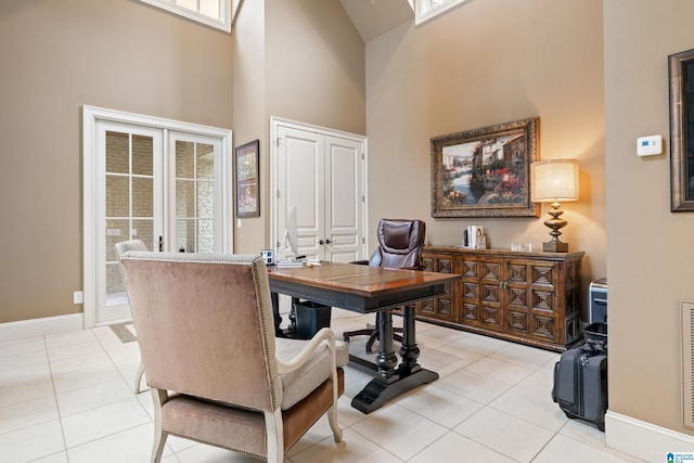 tiled office featuring a towering ceiling