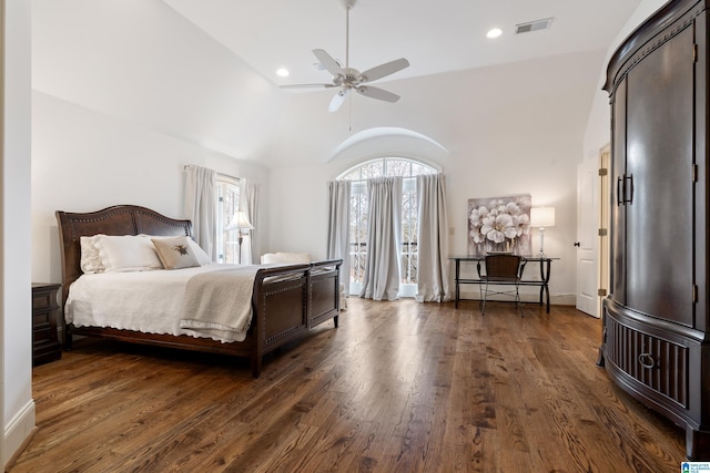 bedroom with lofted ceiling, dark hardwood / wood-style floors, and ceiling fan