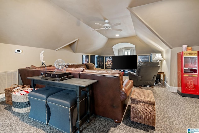 living room with ceiling fan, carpet flooring, and lofted ceiling