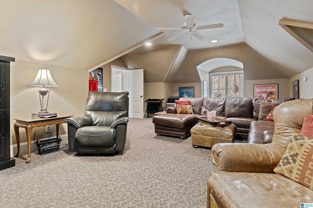 carpeted living room featuring vaulted ceiling and ceiling fan