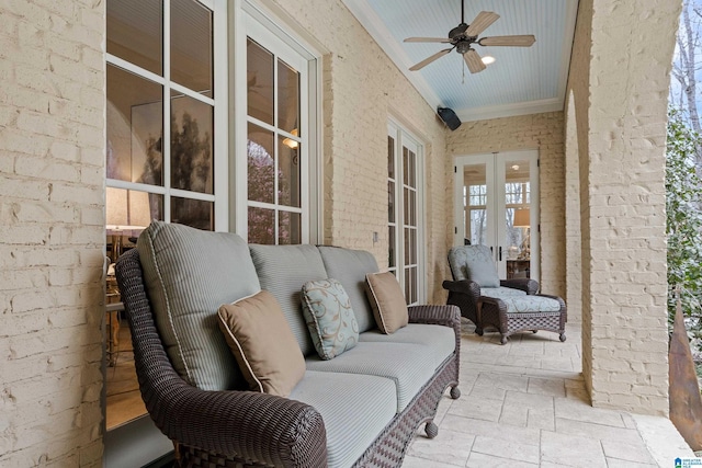 view of patio / terrace featuring ceiling fan and french doors