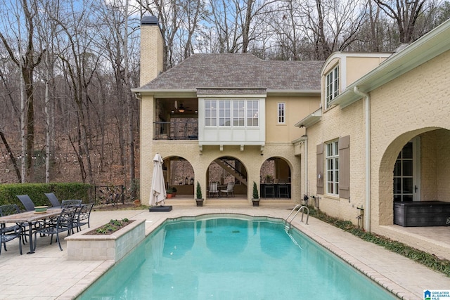 view of pool featuring a patio and ceiling fan