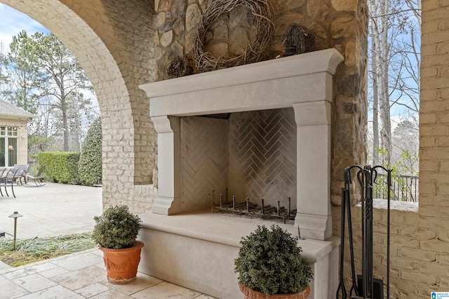 view of patio / terrace with exterior fireplace