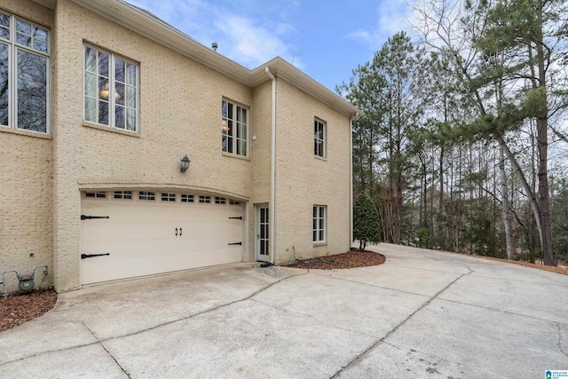 view of side of property with a garage