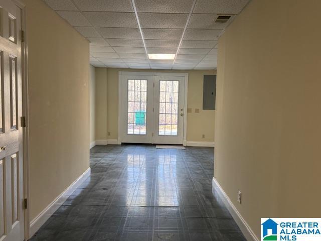 entryway featuring a paneled ceiling and electric panel