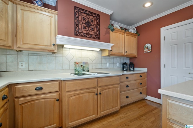 kitchen featuring crown molding, light hardwood / wood-style floors, range hood, black electric cooktop, and backsplash