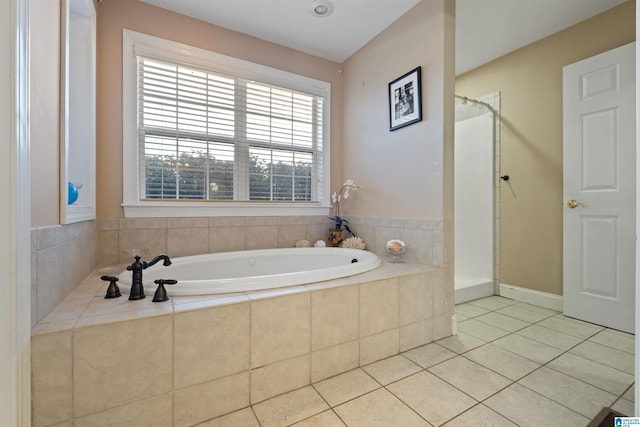 bathroom featuring plus walk in shower and tile patterned flooring