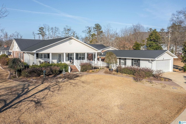 ranch-style home with a porch and a garage