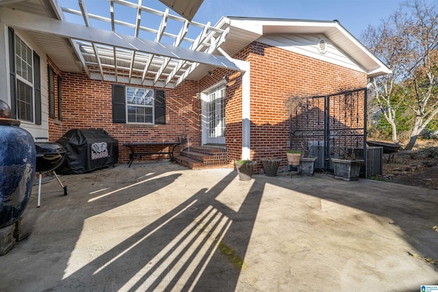 view of patio / terrace featuring a grill and a pergola