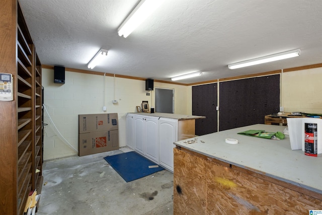 interior space with a textured ceiling