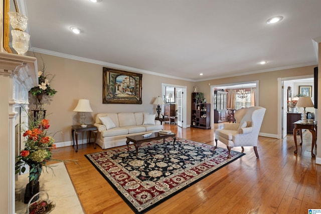 living room featuring crown molding and hardwood / wood-style floors