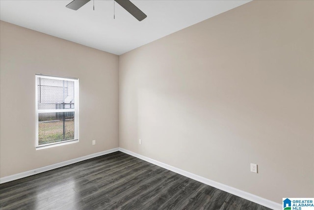 spare room featuring dark hardwood / wood-style floors and ceiling fan