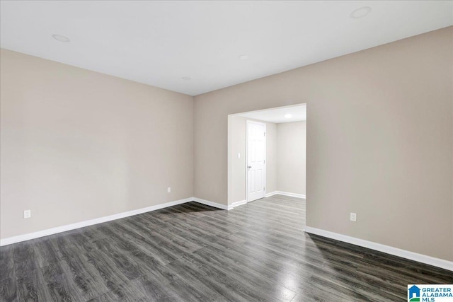 empty room featuring dark wood-type flooring