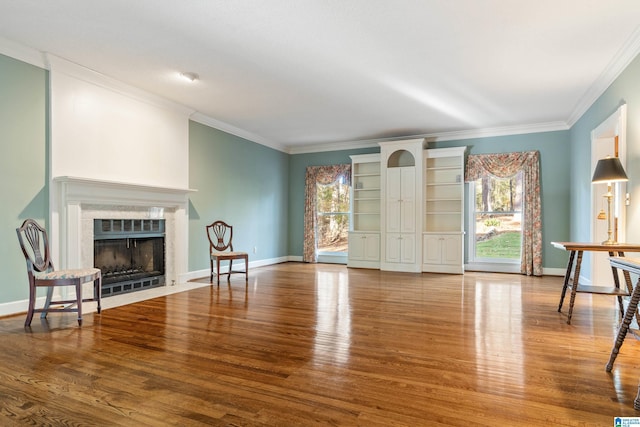 living room with ornamental molding and wood-type flooring