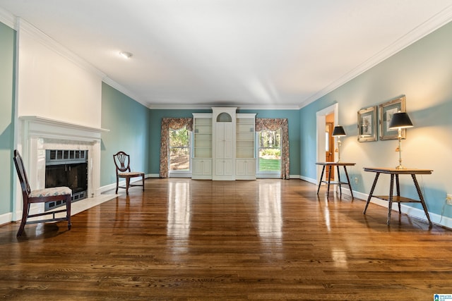 living room with a premium fireplace, ornamental molding, and dark wood-type flooring