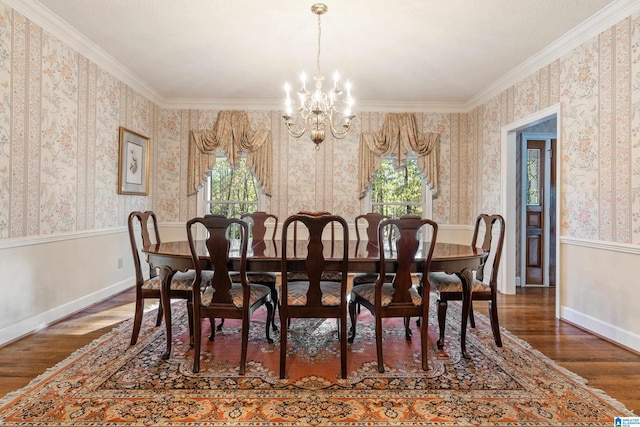 dining area featuring a healthy amount of sunlight, a chandelier, dark hardwood / wood-style floors, and ornamental molding