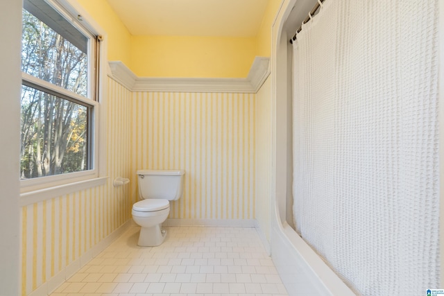 bathroom featuring toilet and tile patterned floors