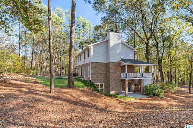 view of side of property featuring a balcony