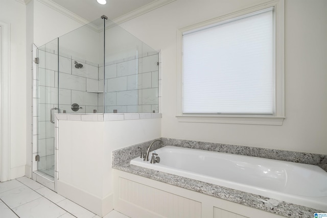 bathroom featuring ornamental molding and independent shower and bath