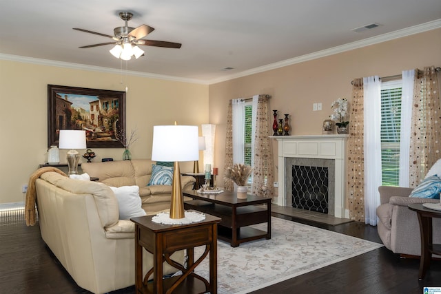 living room featuring ceiling fan, dark hardwood / wood-style floors, and crown molding