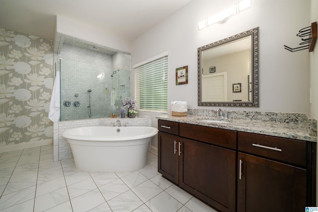 bathroom with vanity and separate shower and tub