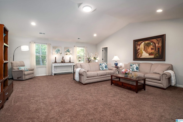 carpeted living room featuring lofted ceiling