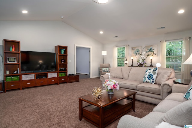 carpeted living room with lofted ceiling